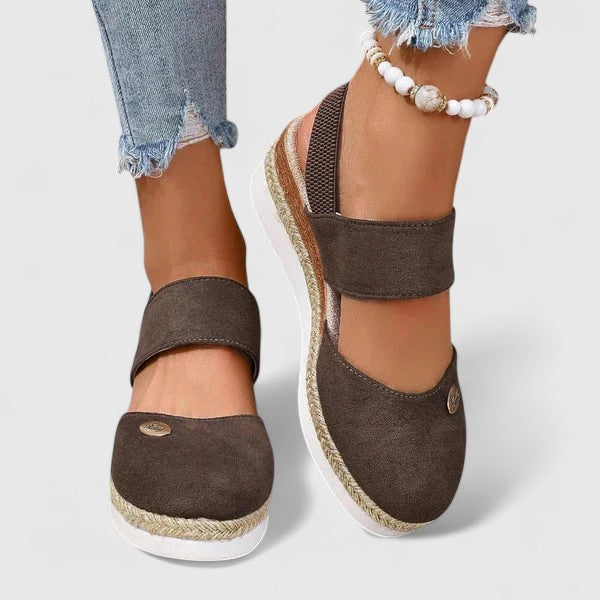 Beige Maylien™ orthopedic sandals by THE WHITMORE FAMILY with cushioned soles and adjustable straps for comfortable support.