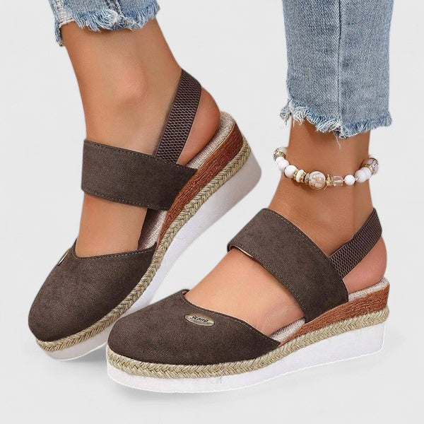 Beige Maylien™ orthopedic sandals by THE WHITMORE FAMILY featuring cushioned soles and adjustable straps.