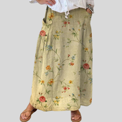 Beige Mella™ retro floral art skirt by THE WHITMORE FAMILY featuring elastic waistband and side pockets.