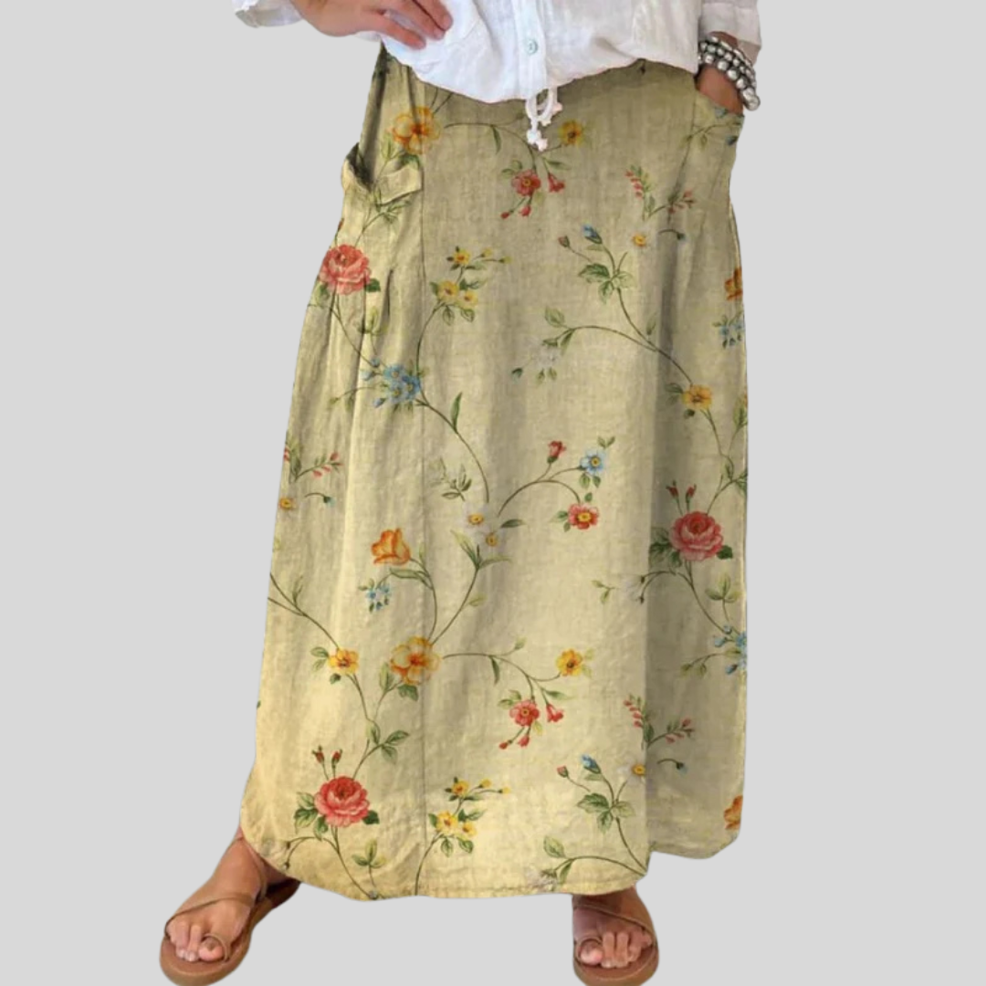 Beige Mella™ retro floral art skirt by THE WHITMORE FAMILY featuring elastic waistband and side pockets.