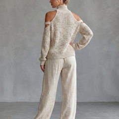 Beige open shoulder knit top and wide-leg pants set by THE WHITMORE FAMILY, styled together on a model.