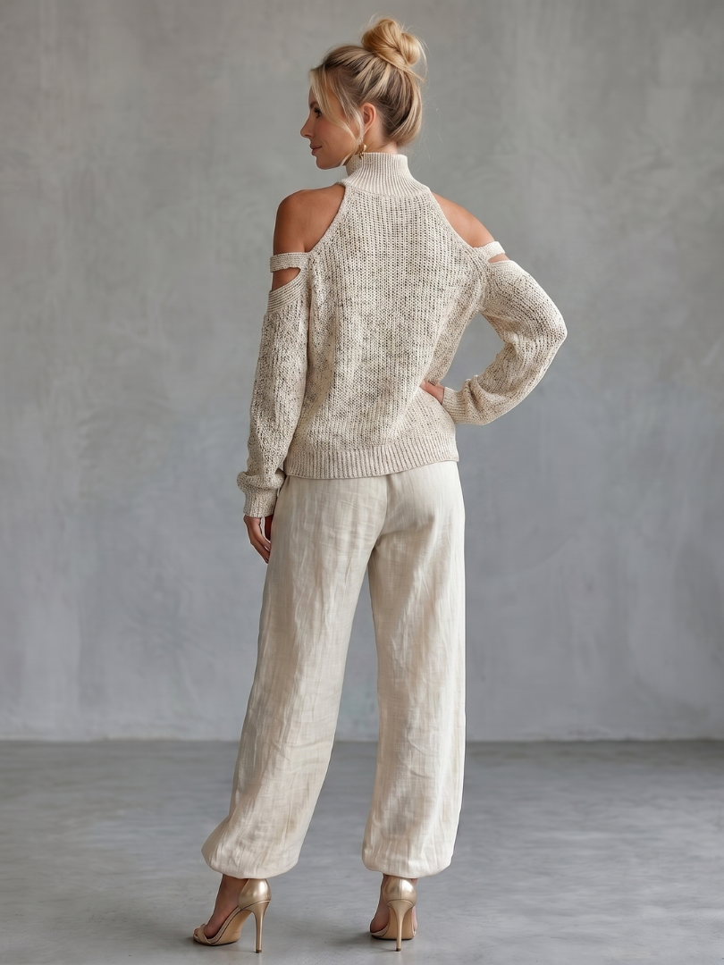 Beige open shoulder knit top and wide-leg pants set by THE WHITMORE FAMILY, styled together on a model.
