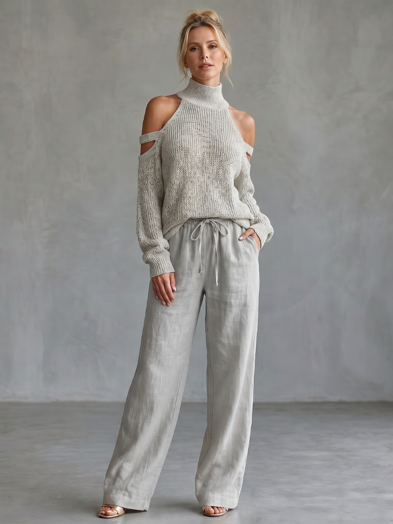 Beige open shoulder knit top and wide-leg pants set by THE WHITMORE FAMILY, stylish casual outfit with relaxed fit.