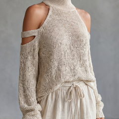 Beige open shoulder knit top and wide-leg pants set by THE WHITMORE FAMILY, displayed on a model.
