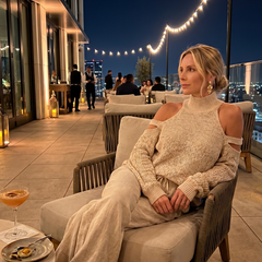 Beige open shoulder knit top and wide-leg pants set by THE WHITMORE FAMILY, stylish and comfortable fashion ensemble.
