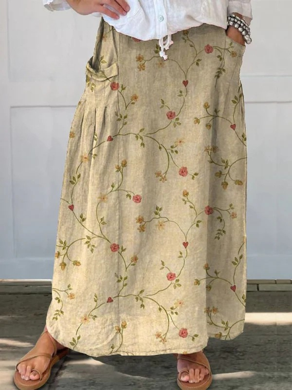 Beige Shane™ retro floral art elastic waistband pocket skirt by THE WHITMORE FAMILY, with a floral pattern and functional pockets.