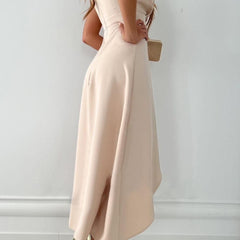 Beige Julie dress by THE WHITMORE FAMILY featuring pink floral pattern, V-neckline, and short sleeves.
