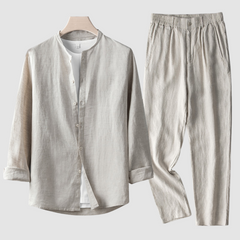 Beige Larkin™ Linen Set by THE WHITMORE FAMILY, featuring soft, textured linen fabric with neatly folded sheets and pillowcases.