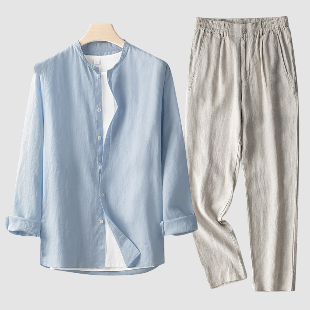 Beige Larkin™ Linen Set by THE WHITMORE FAMILY, featuring neatly folded linen bedding on a bed.