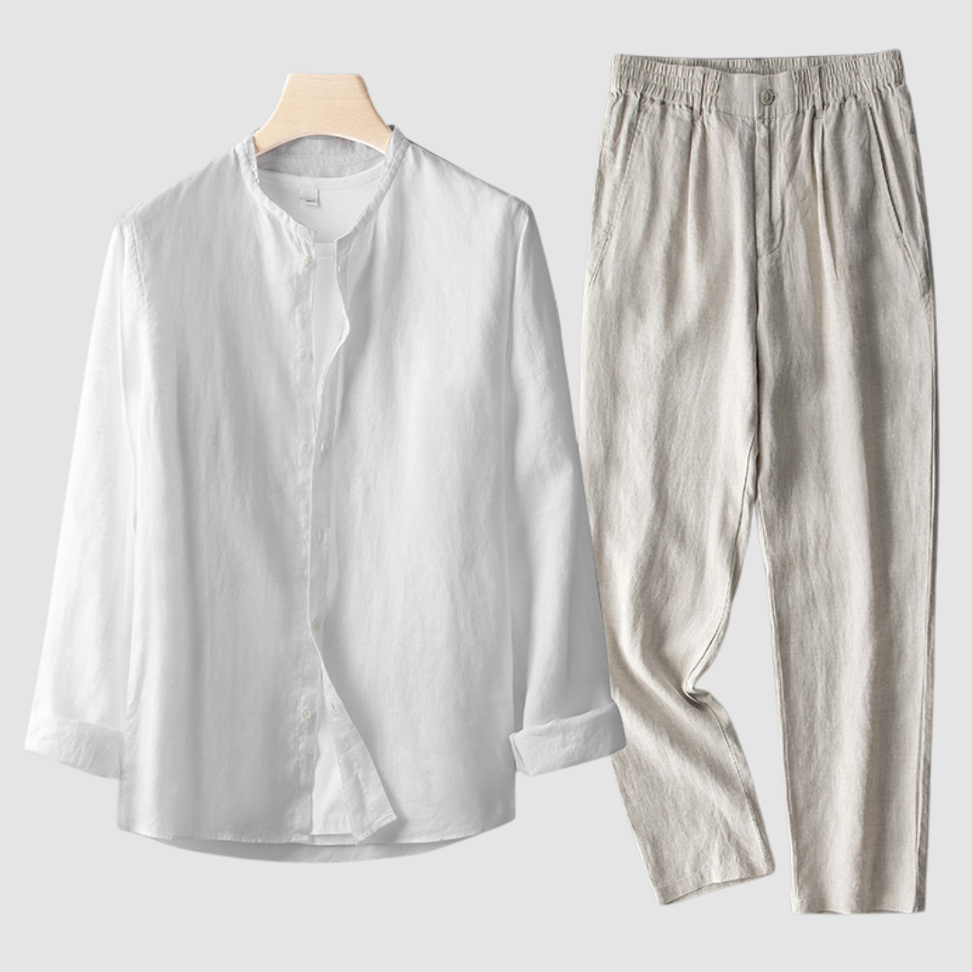 Beige Larkin™ linen set by THE WHITMORE FAMILY, featuring soft, textured fabric and neatly arranged bedding on a bed.