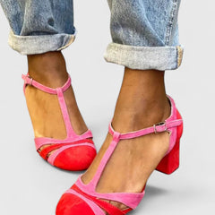 Lazariah modern heels in berry red by THE WHITMORE FAMILY, featuring sleek design and pointed toe on a white background.