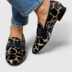 Black Clyanne Premium Orthopedic Loafers by THE WHITMORE FAMILY, showcasing stylish, supportive footwear with a sleek design.