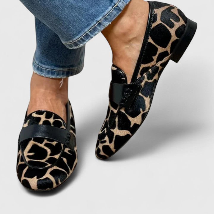 Black Clyanne Premium Orthopedic Loafers by THE WHITMORE FAMILY, showcasing stylish, supportive footwear with a sleek design.