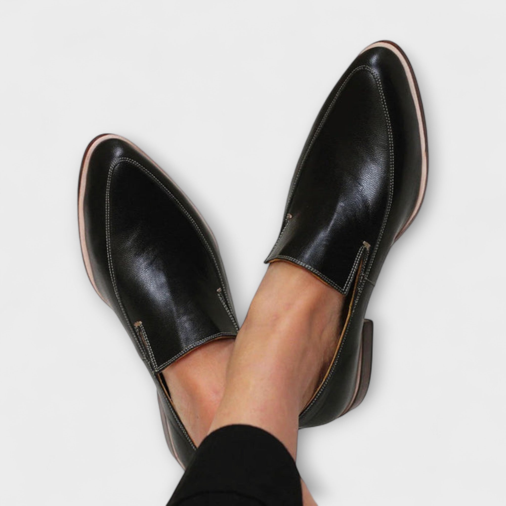 Black Jhazmiel orthopedic loafers by THE WHITMORE FAMILY, showcasing comfortable, supportive slip-on footwear for men.