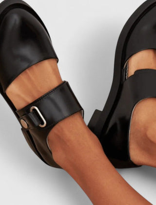 Black Lyssavelle elegant shoes by THE WHITMORE FAMILY featuring sleek design and pointed toes.