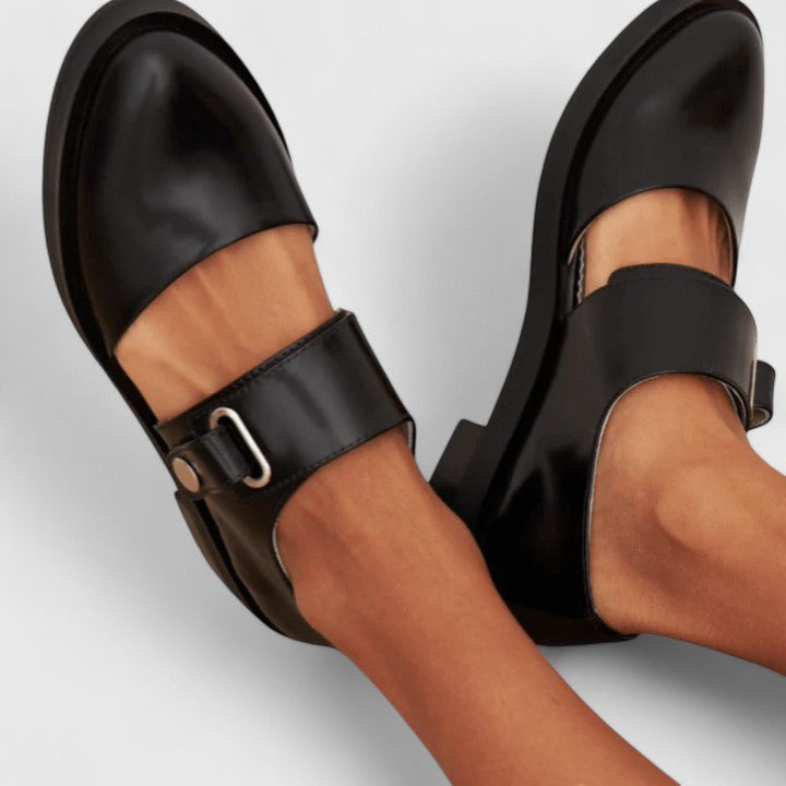 Black Lyssavelle elegant shoes by THE WHITMORE FAMILY featuring sleek design and pointed toes.