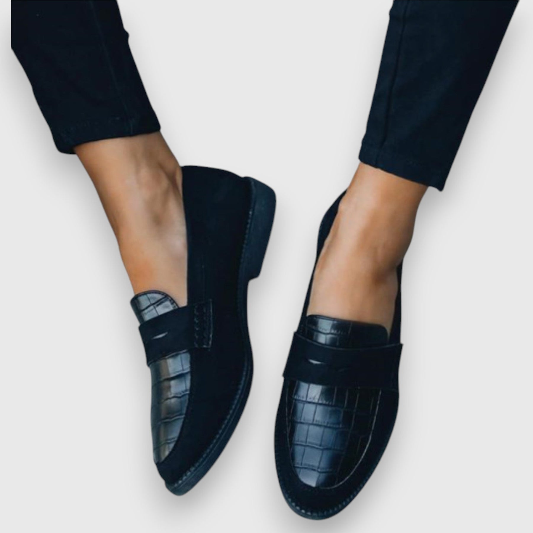 Black Mariluz orthopedic loafers by THE WHITMORE FAMILY, featuring a classic slip-on design and cushioned comfort.