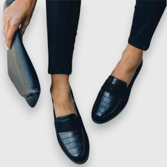 Black Mariluz orthopedic loafers by THE WHITMORE FAMILY featuring comfortable slip-on design and supportive sole.