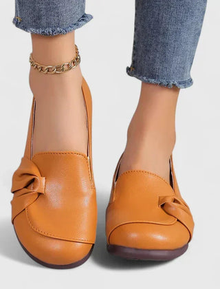 Black Ivarynn elegant shoes by THE WHITMORE FAMILY, stylish women's footwear with a sleek design and pointed toe.