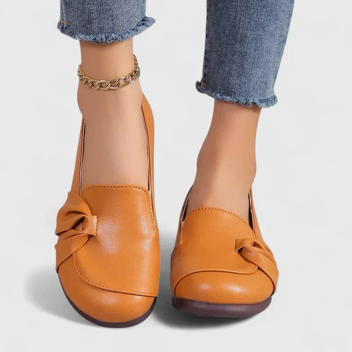 Black Ivarynn elegant shoes by THE WHITMORE FAMILY, stylish women's footwear with a sleek design and pointed toe.