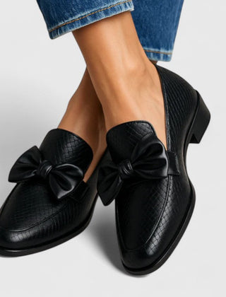 Black Vaenyss Luxe Comfort Loafers by THE WHITMORE FAMILY, featuring sleek leather design and comfortable slip-on style.