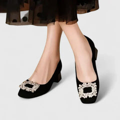 Black Julianyssa orthopaedic heels by THE WHITMORE FAMILY with supportive design and stylish appearance.
