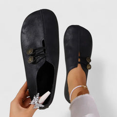 Black Kyline elegant loafers by THE WHITMORE FAMILY, featuring a sleek design and comfortable slip-on style.