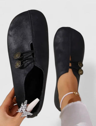 Black Kyline elegant loafers by THE WHITMORE FAMILY, featuring a sleek design and comfortable slip-on style.