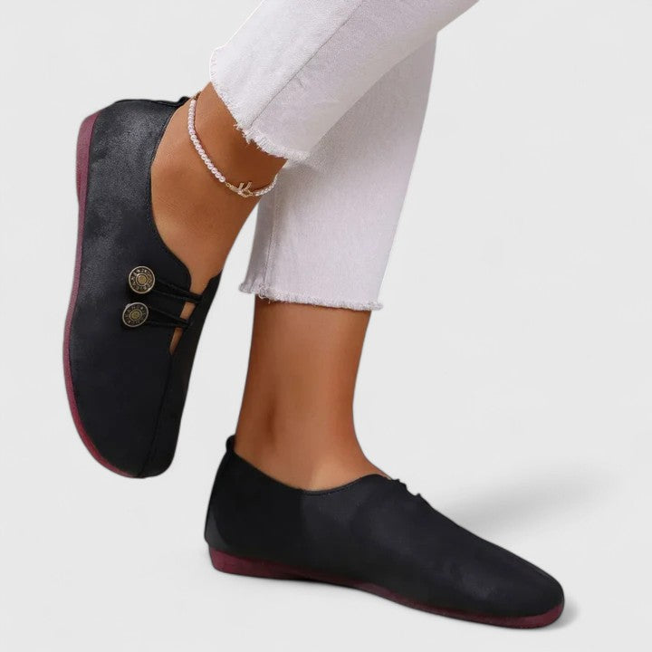 Black Kyline elegant loafers by THE WHITMORE FAMILY, featuring a sleek design and polished leather finish.