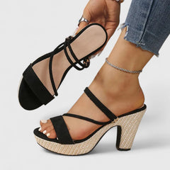 Black Lorienna sophisticated heels by THE WHITMORE FAMILY with sleek design and pointed toe, perfect for formal occasions.