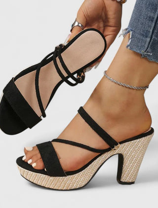 Black Lorienna sophisticated heels by THE WHITMORE FAMILY with sleek design and pointed toe, perfect for formal occasions.