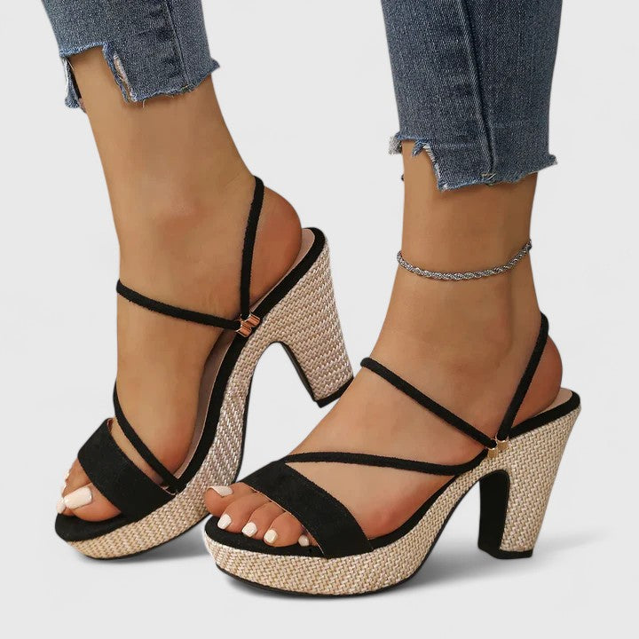 Black Lorienna sophisticated heels by THE WHITMORE FAMILY with sleek pointed toes and elegant design.