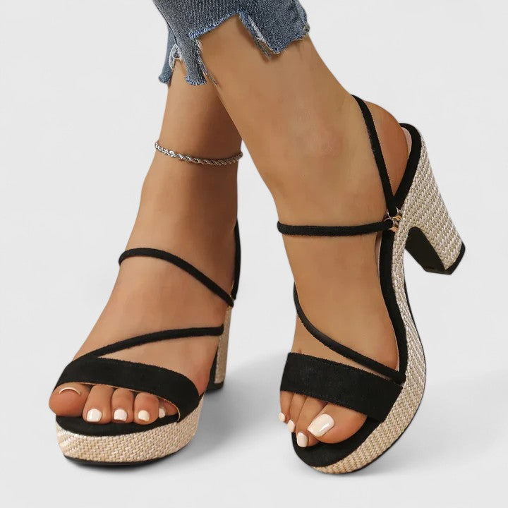 Black Lorienna sophisticated heels by THE WHITMORE FAMILY, featuring elegant pointed toes and sleek stiletto heels.