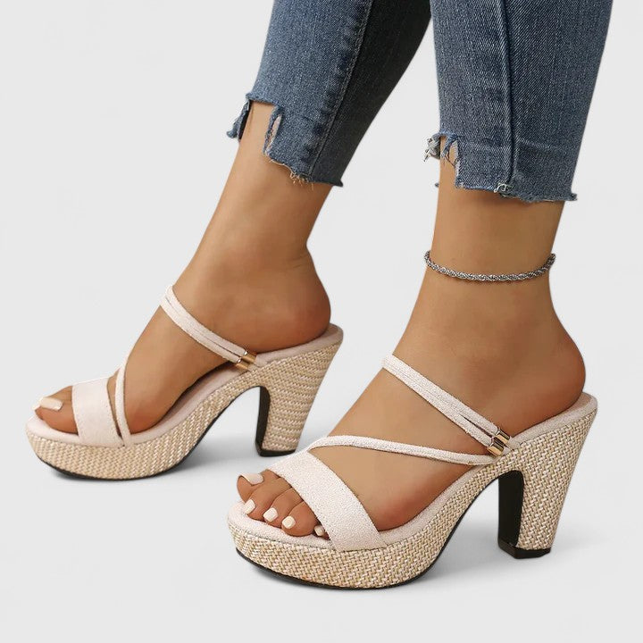 Black Lorienna sophisticated heels by THE WHITMORE FAMILY featuring sleek design and elegant pointed toes.