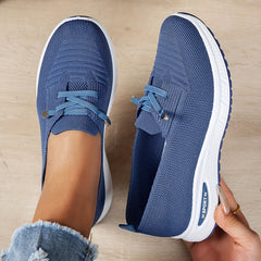 Black Louna™ ergonomic support sneakers by THE WHITMORE FAMILY, featuring cushioned insoles and supportive design for comfort.