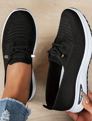 Black Louna™ ergonomic support sneakers by THE WHITMORE FAMILY featuring cushioned soles and supportive design for comfort.