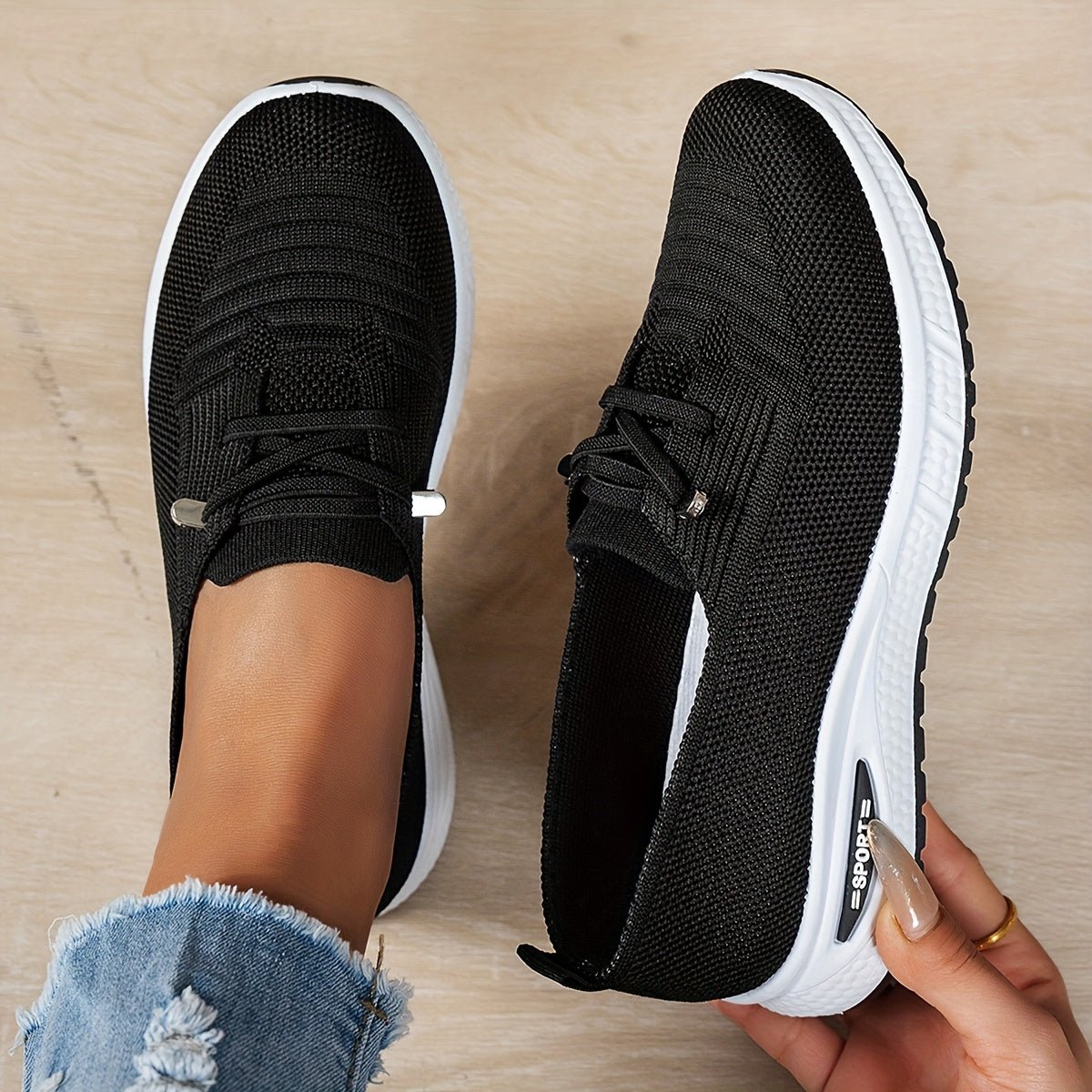 Black Louna™ ergonomic support sneakers by THE WHITMORE FAMILY featuring cushioned soles and supportive design for comfort.