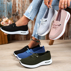 Black Louna™ ergonomic support sneakers by THE WHITMORE FAMILY featuring cushioned soles and breathable fabric for comfortable walking.