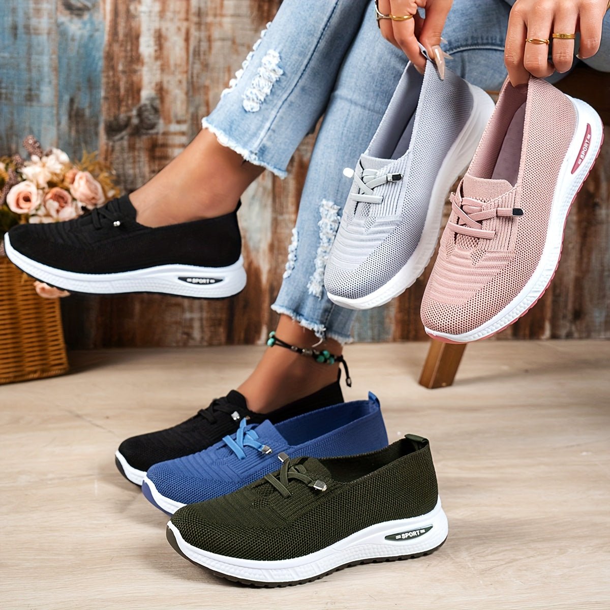 Black Louna™ ergonomic support sneakers by THE WHITMORE FAMILY featuring cushioned soles and breathable fabric for comfortable walking.