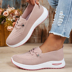 Black Louna™ ergonomic support sneakers by THE WHITMORE FAMILY, showcasing cushioned soles and breathable mesh material.