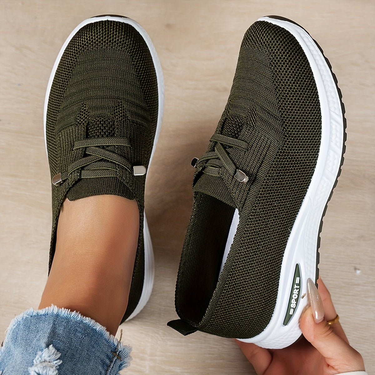 Black Louna™ ergonomic support sneakers by THE WHITMORE FAMILY, featuring cushioned insoles and stylish athletic design.