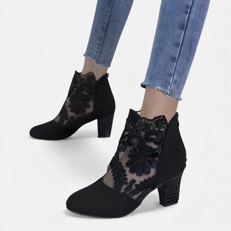Black Norene stylish breathable orthopedic heels by THE WHITMORE FAMILY, showcasing a sleek design and comfortable fit.