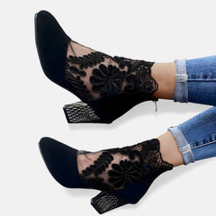 Black Norene stylish breathable orthopaedic heels by THE WHITMORE FAMILY, showcasing their comfortable design and elegant heel shape.