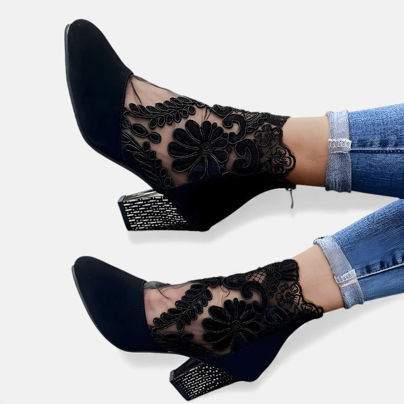 Black Norene stylish breathable orthopaedic heels by THE WHITMORE FAMILY, showcasing their comfortable design and elegant heel shape.