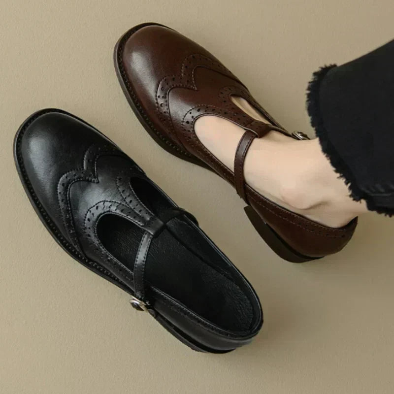 Black Patricia T-Strap Mary Janes by THE WHITMORE FAMILY featuring elegant design and comfortable slip-on style.