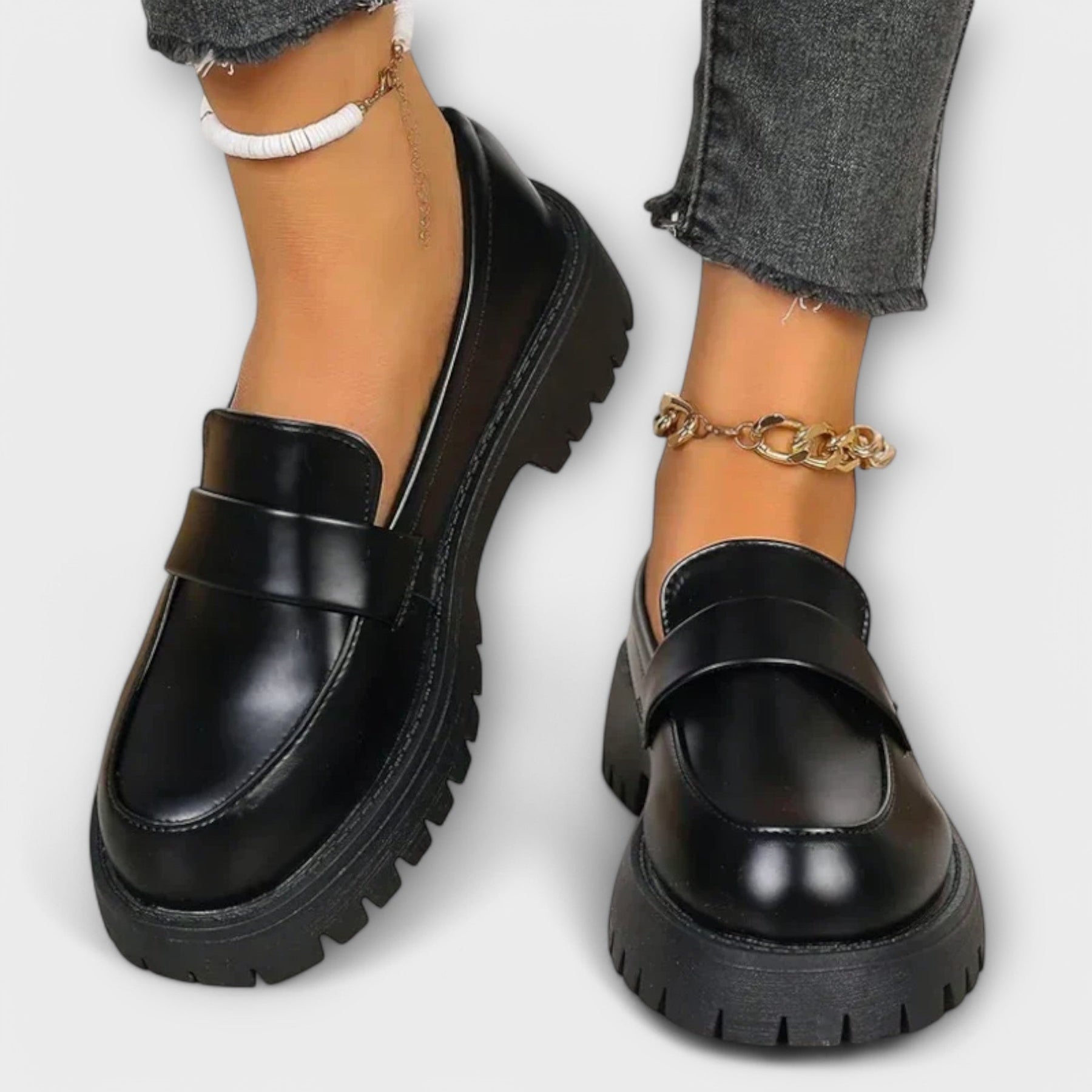 Black Pia orthopedic loafers by THE WHITMORE FAMILY featuring a sleek design and comfortable sole, ideal for everyday wear.