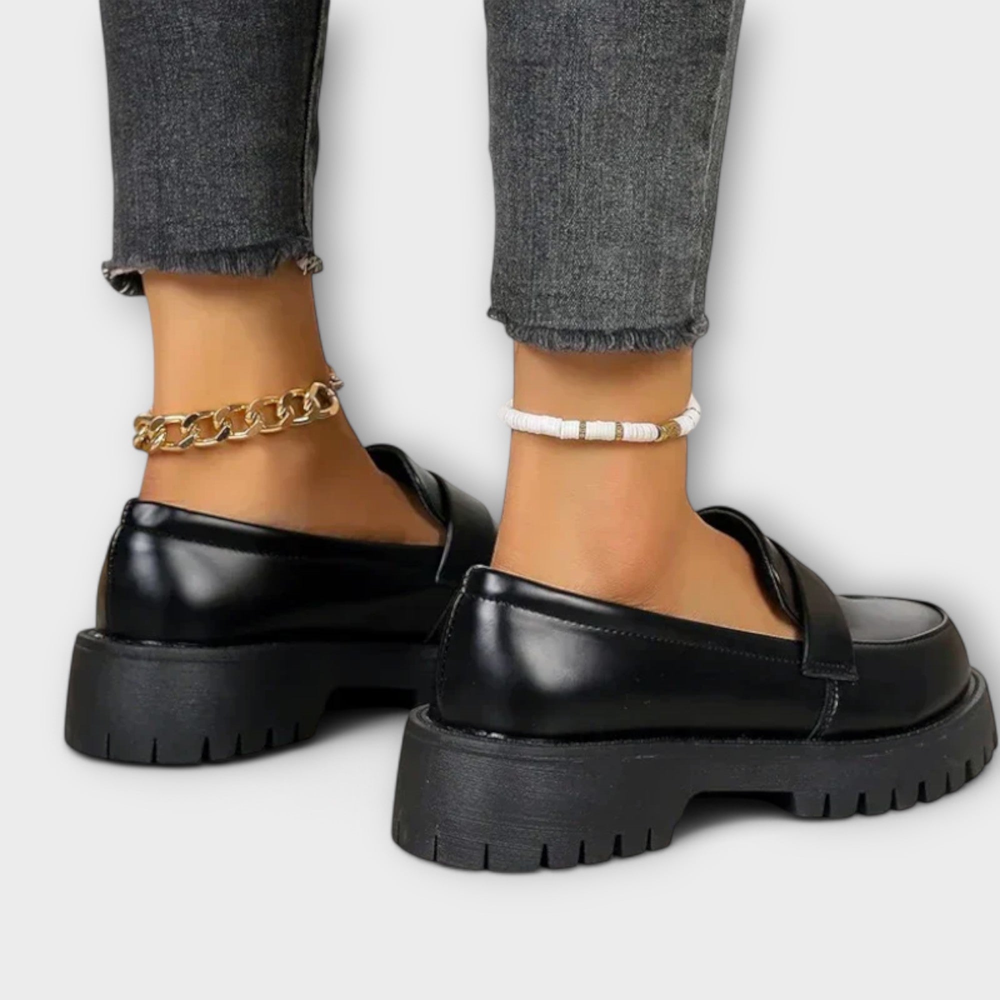 Black Pia orthopedic loafers by THE WHITMORE FAMILY featuring a classic slip-on design and comfortable orthopedic sole.