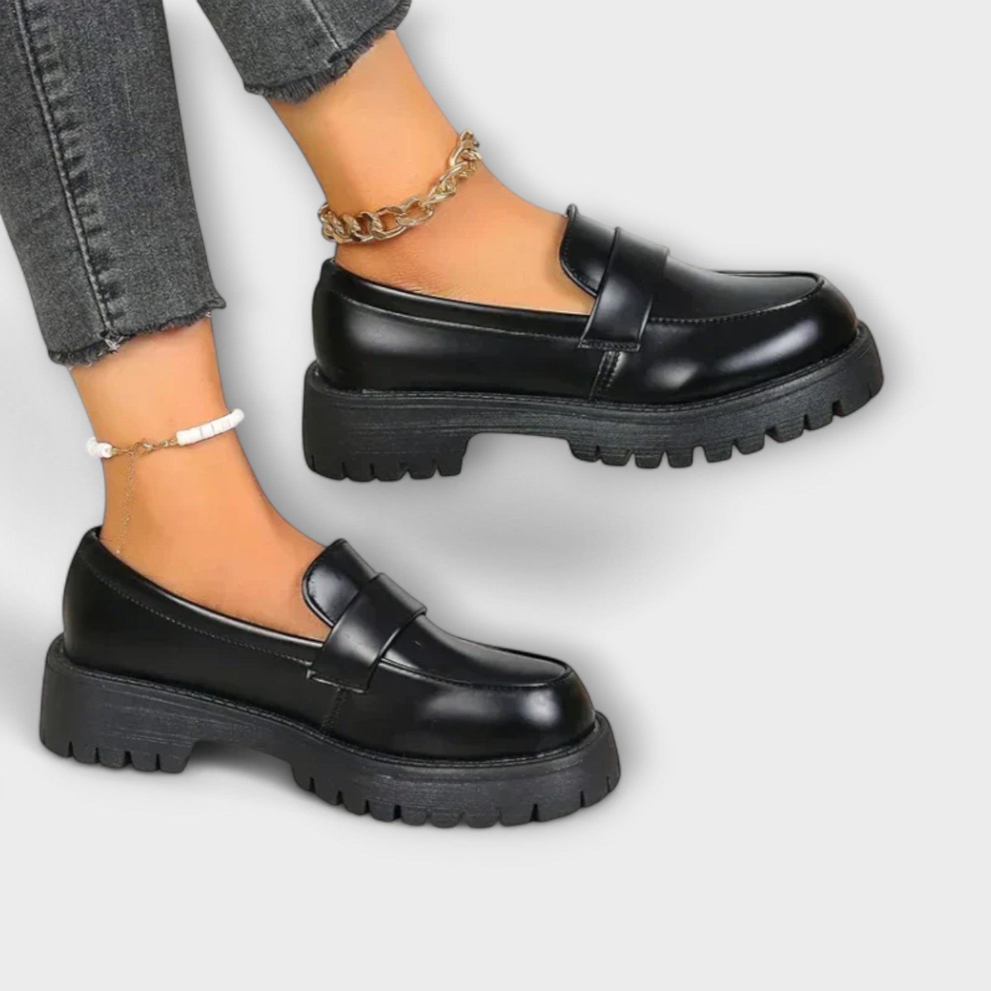 Black Pia orthopedic loafers by THE WHITMORE FAMILY featuring comfortable, supportive design and classic slip-on style.