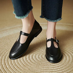 Black Selvana low-heeled pumps by THE WHITMORE FAMILY featuring a classic design and comfortable heel height.