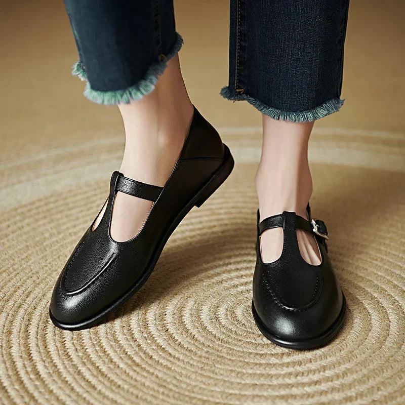 Black Selvana low-heeled pumps by THE WHITMORE FAMILY featuring a classic design and comfortable heel height.